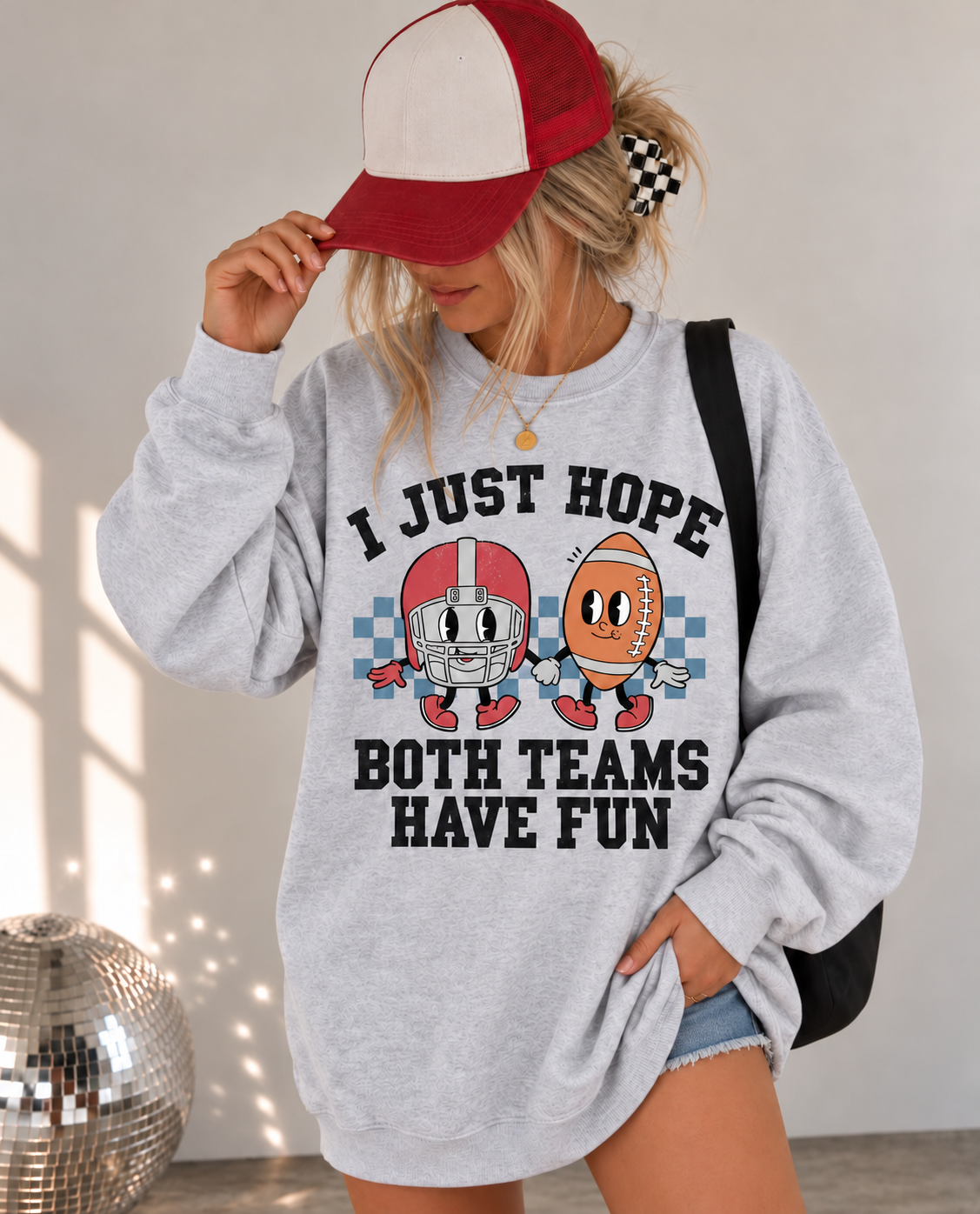 Both Teams Have Fun Crewneck in Ash, styled on a blonde model with denim shorts.