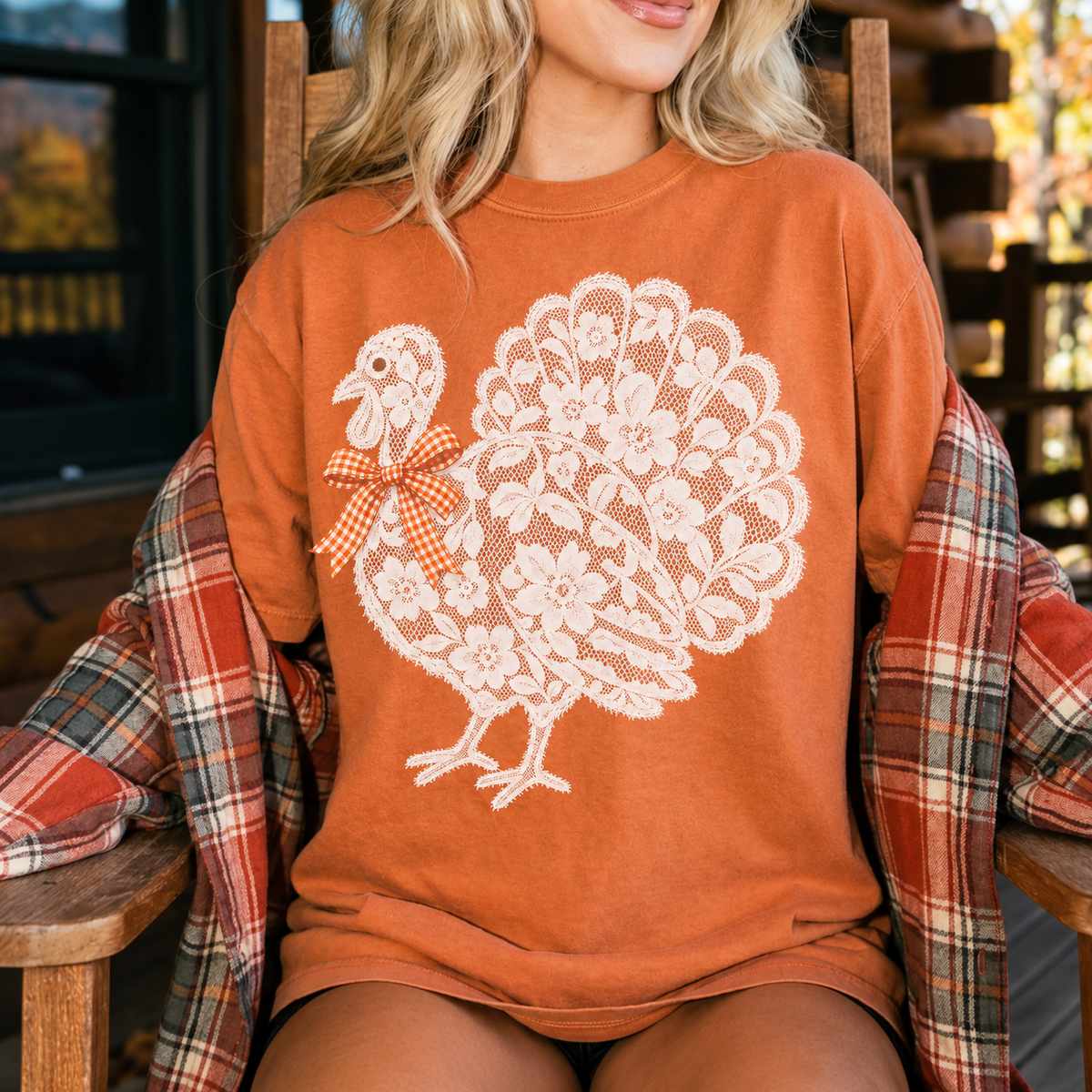 Harvest Lace Turkey Tee in Yam, a Comfort Colors 1717 Thanksgiving shirt with white lace-look turkey and orange gingham bow.