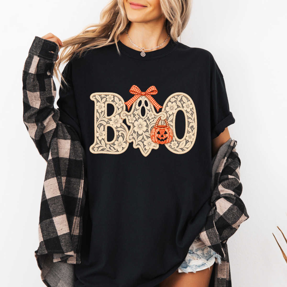 Model wearing the black Lace BOO Ghost Tee with a plaid overshirt